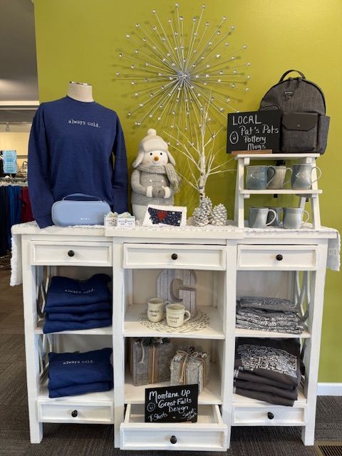 A table with a pillow that says happy pumpkin on it