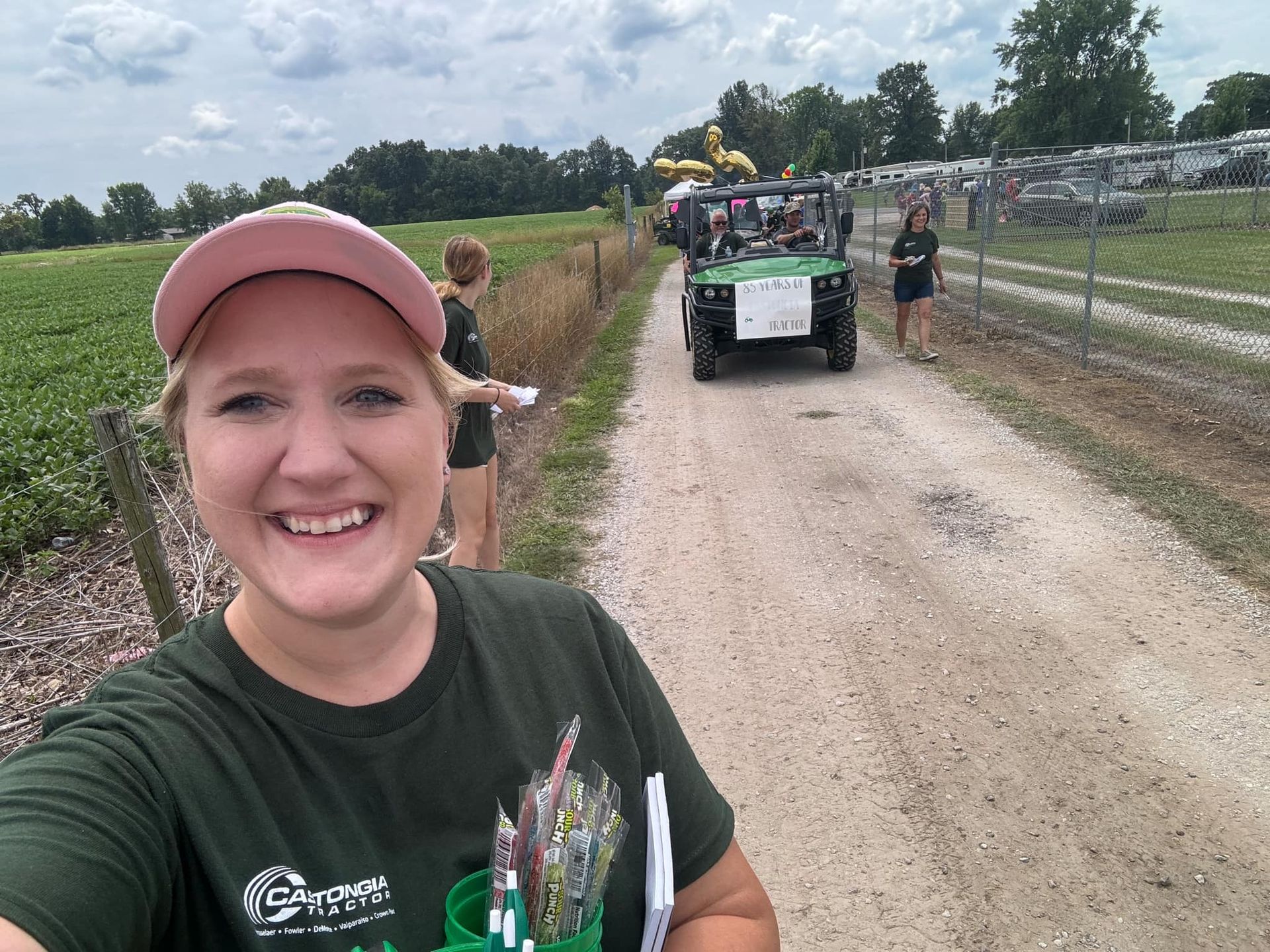 Sales Consultant takes a selfie with parade lineup