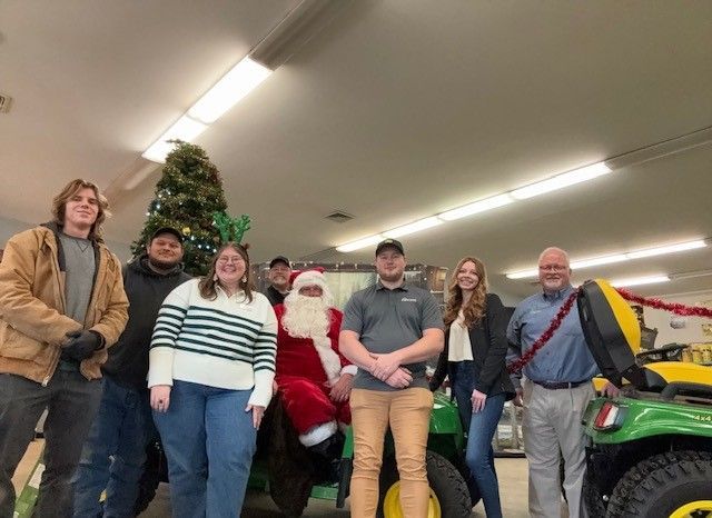 2024 Castongia Tractor Crown Point team poses with Santa