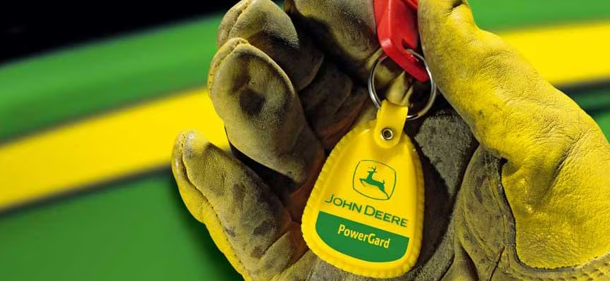 John Deere PowerGard keychain in a gloved hand