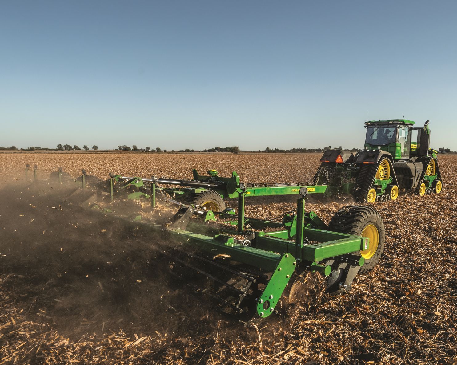 John Deere tractor pulls a John Deere tillage tool