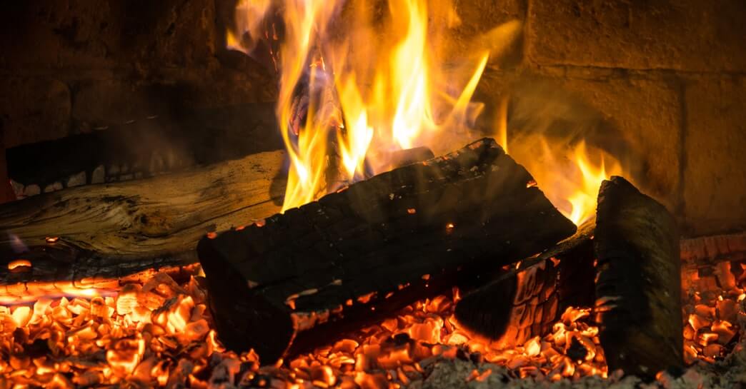 wood burning embers in a fireplace in chicago