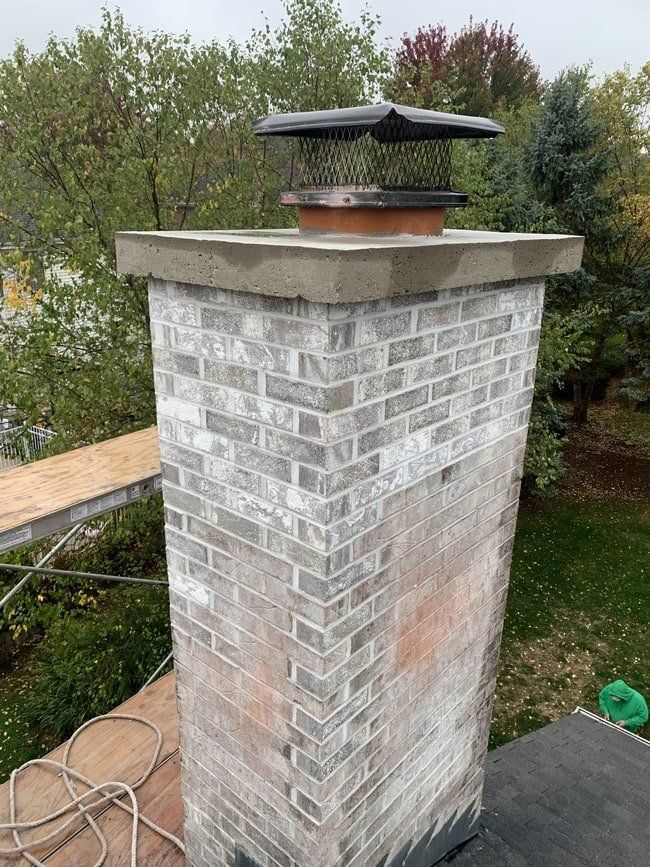 chimney repair in roscoe village chicago - repointed the mortar and replaced the cap