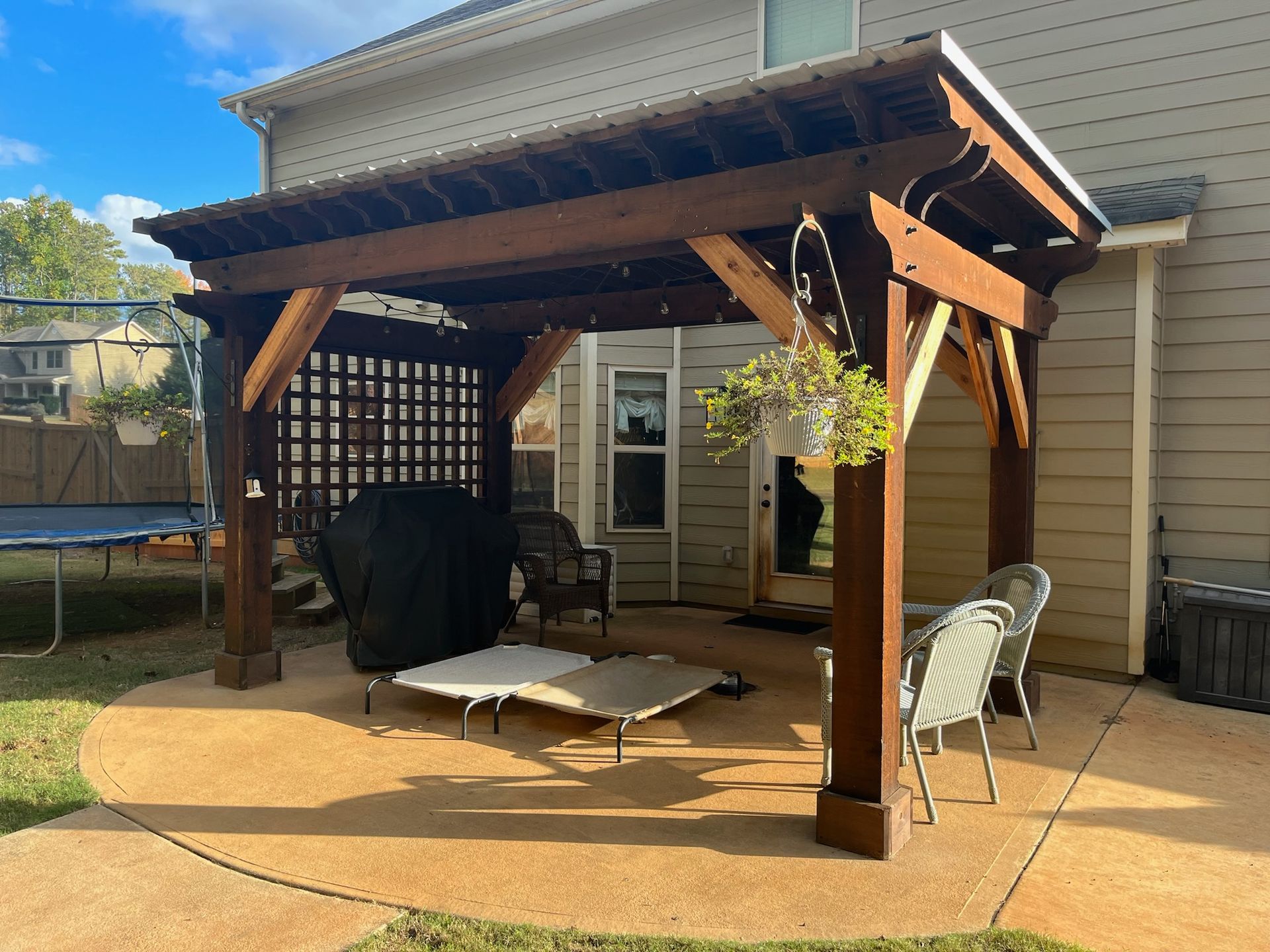 A large white house with a garage and a large lawn in front of it.