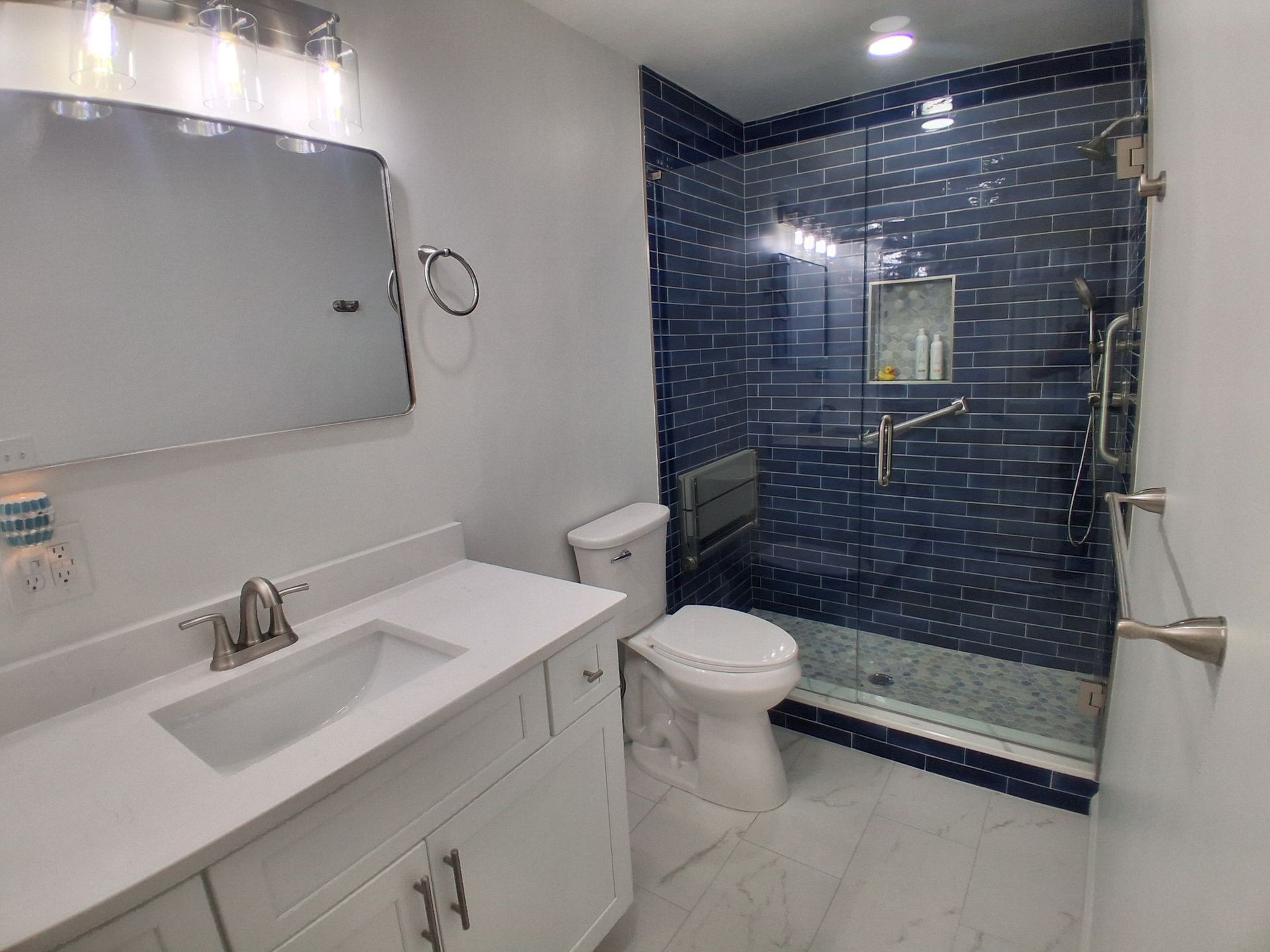 A bathroom with a bathtub a sink and a trash can