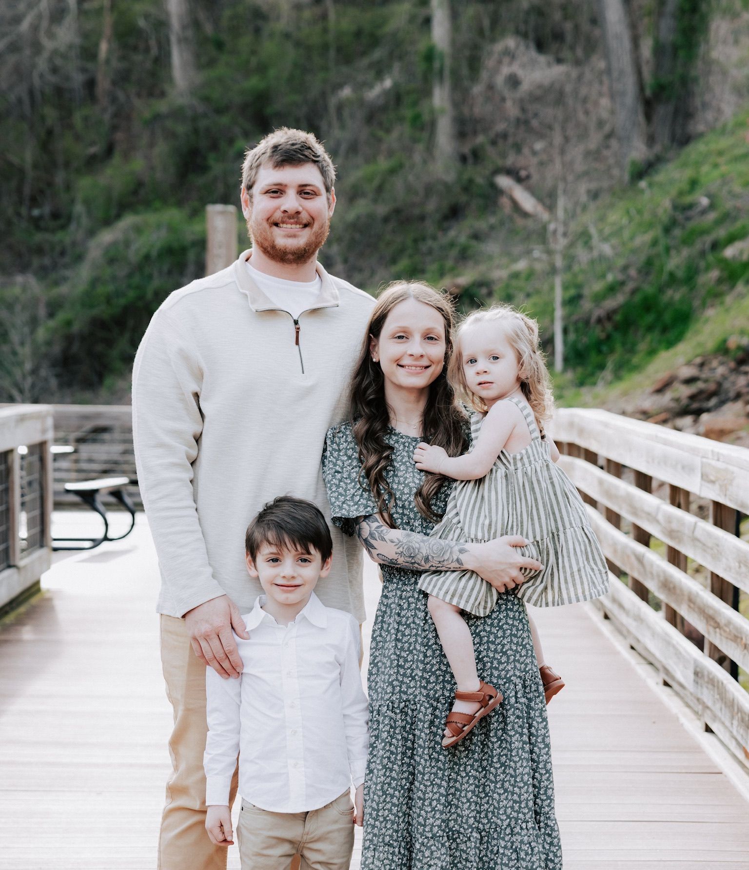 Three men pose for a picture in front of a sign that says southern action