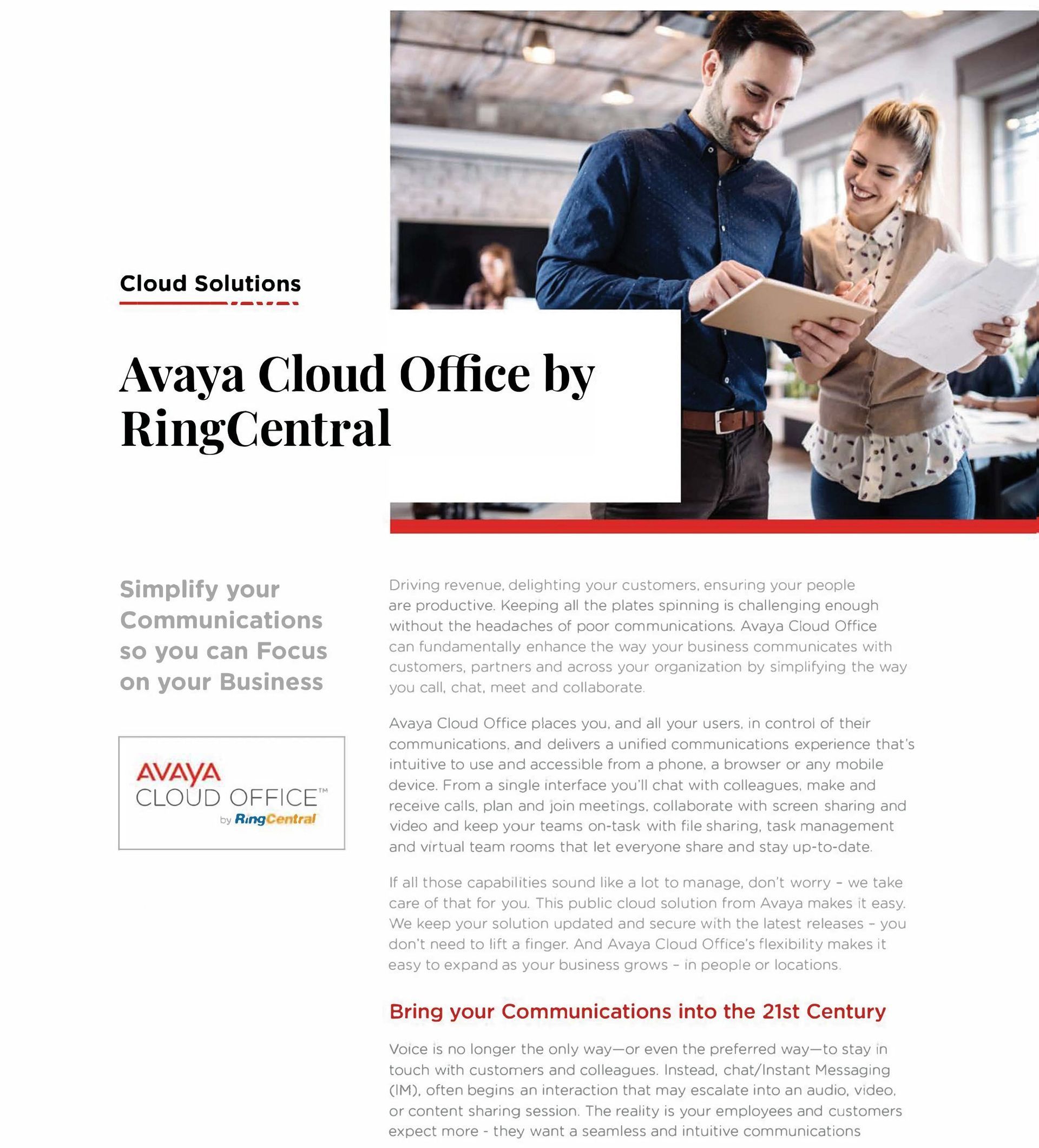 A man and a woman are looking at a tablet in an office.