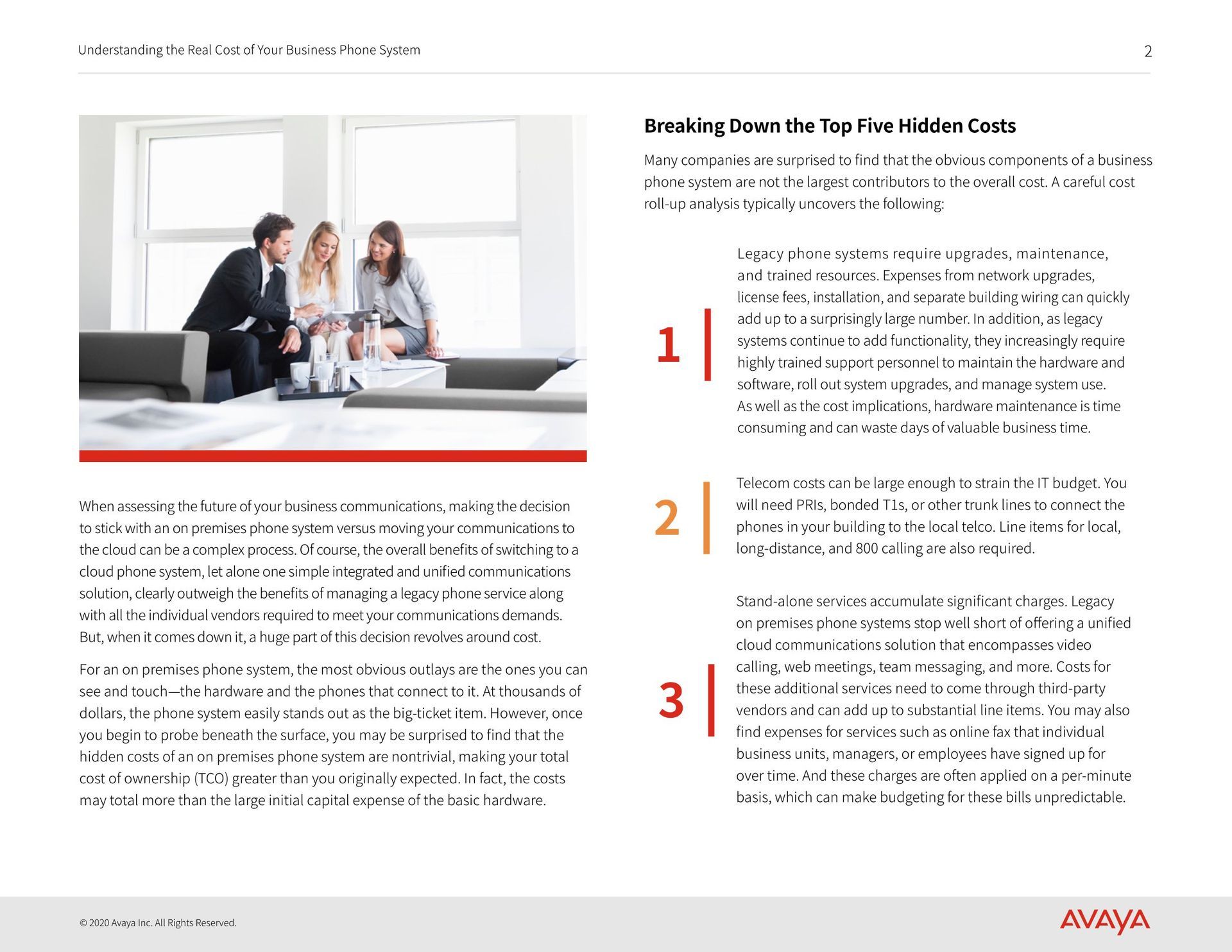 A group of people are sitting on a couch having a meeting.