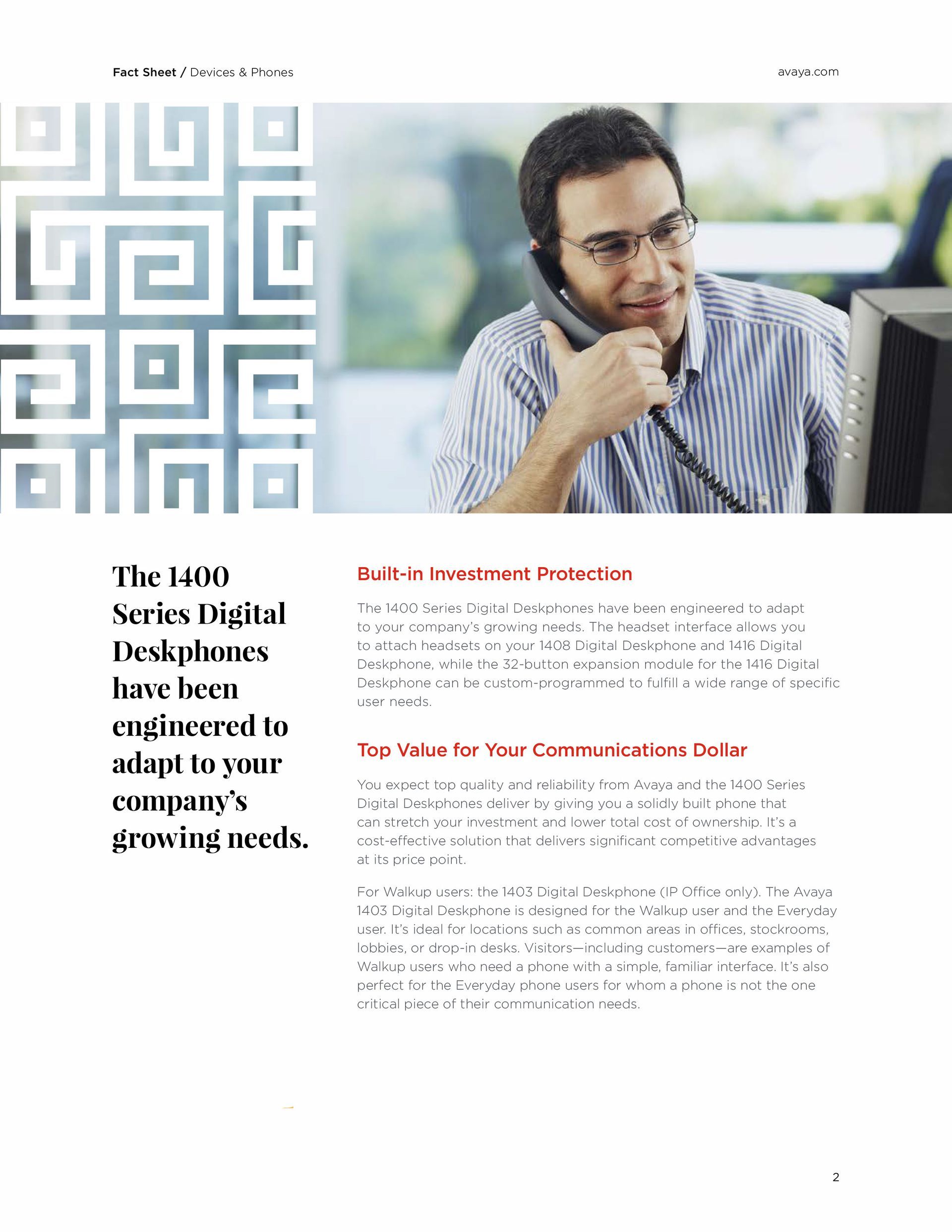 A man is talking on a cell phone in front of a computer.