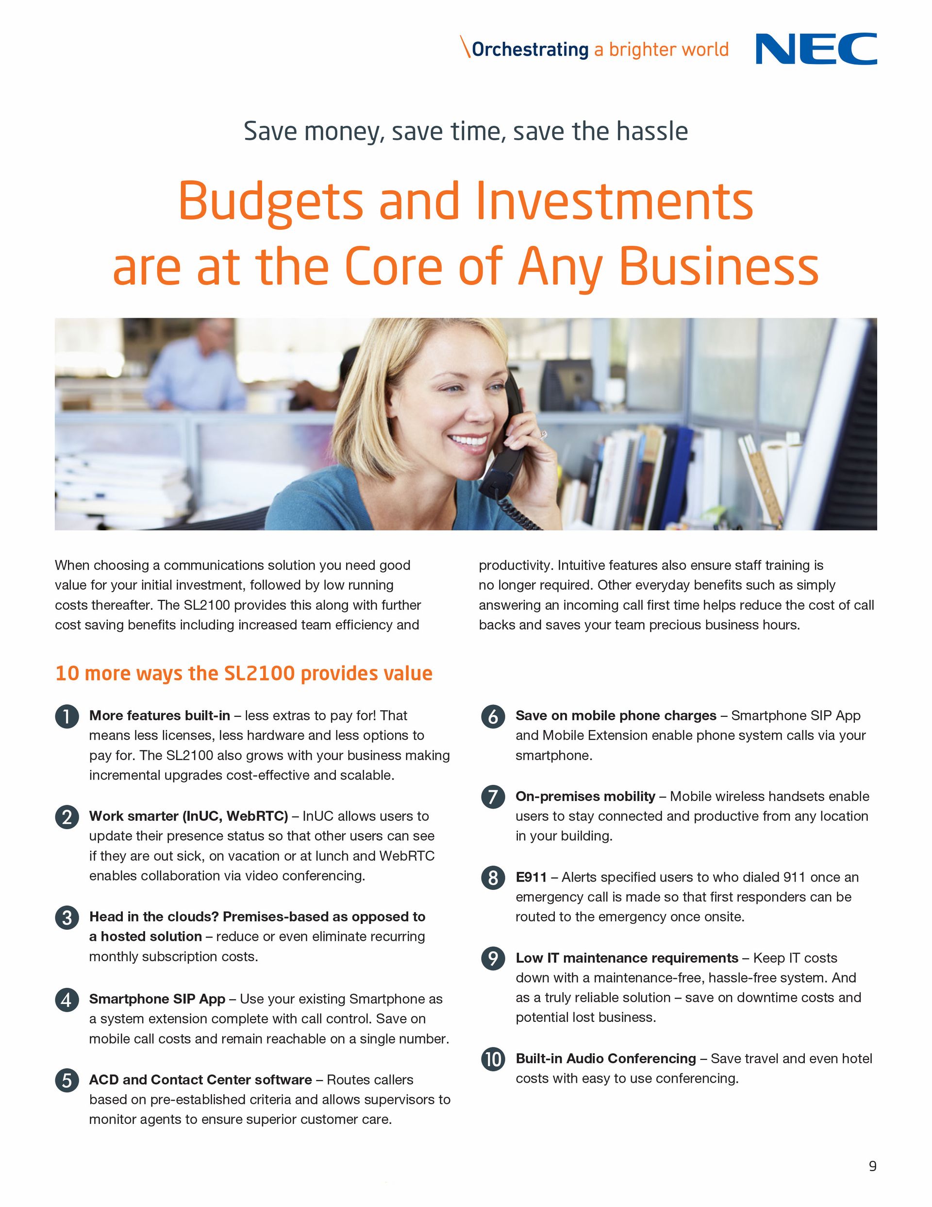 A woman is talking on a cell phone in an office.