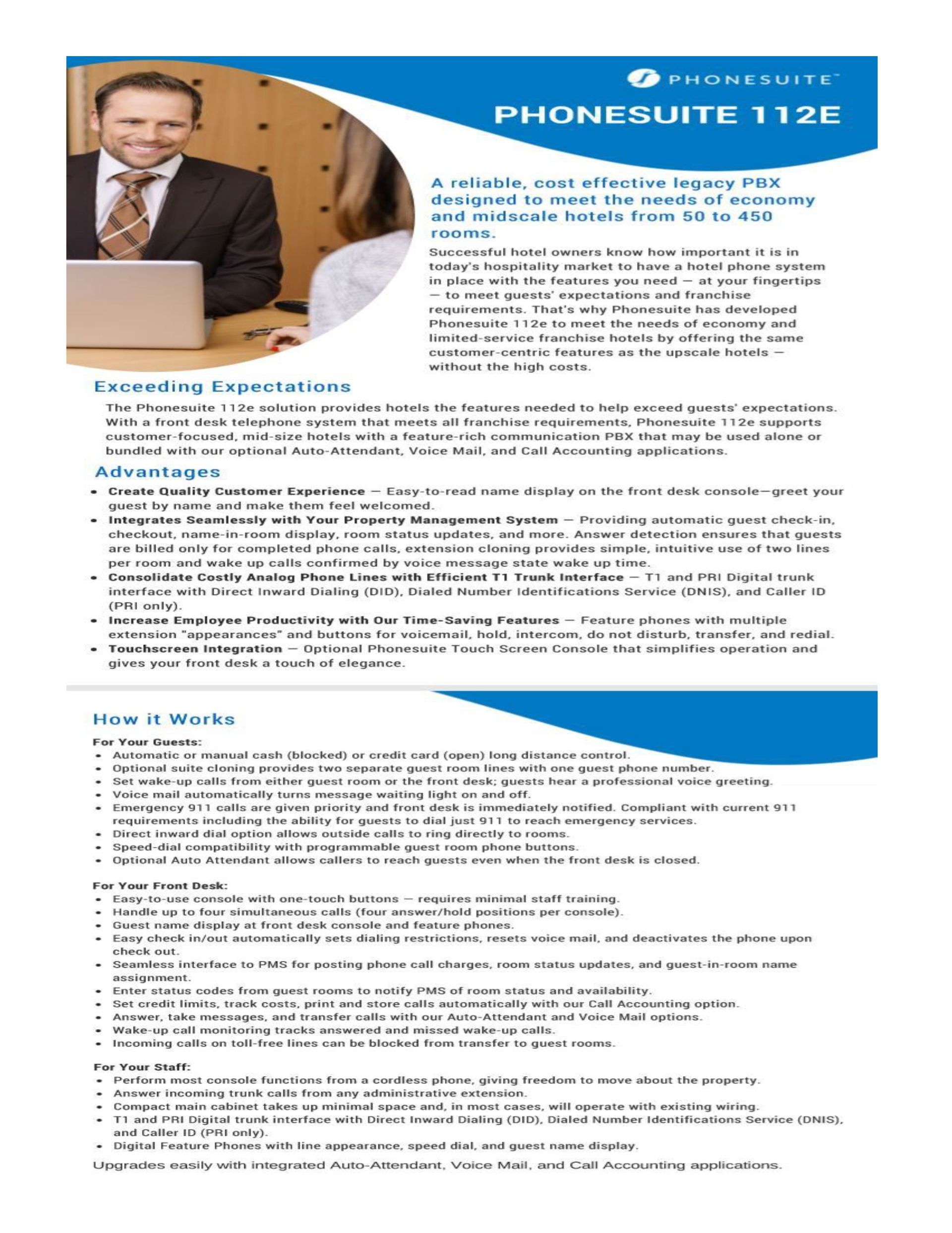 A man in a suit and tie is sitting at a table with a laptop.