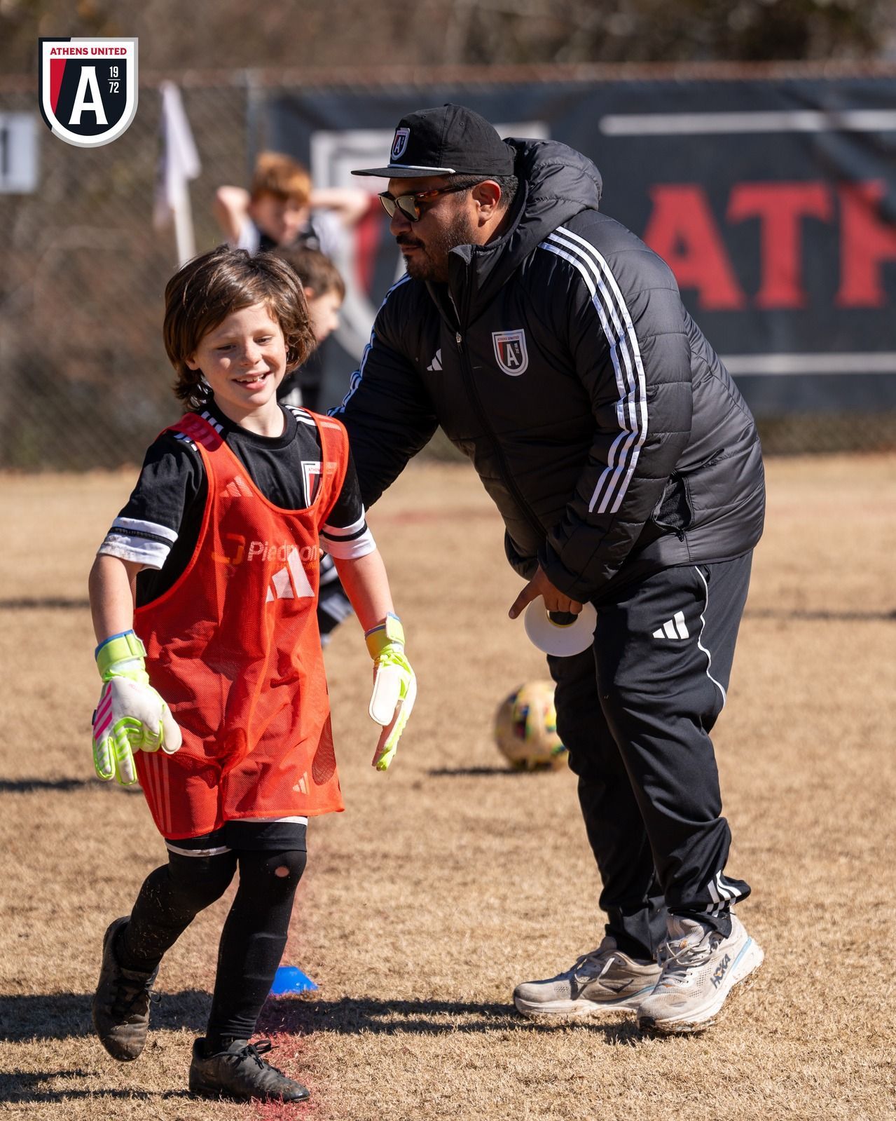 Youth soccer players practicing drills during a clinic