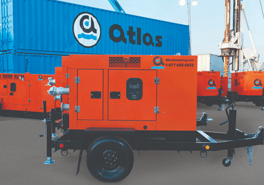 Orange Atlas generator on a trailer, parked in front of a blue Atlas container.