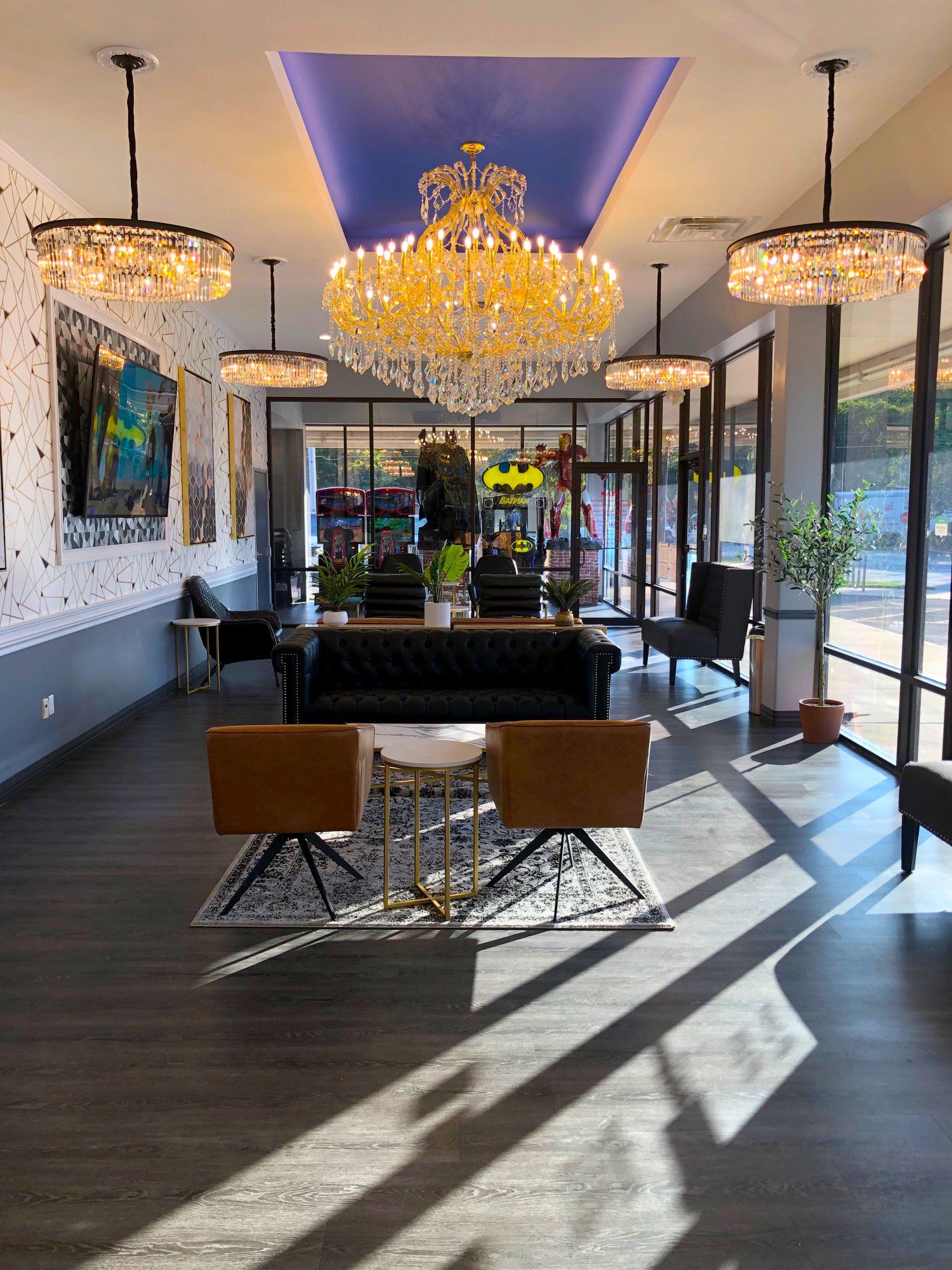 Lucent Dentistry in Austin Tx.  A large lobby with a couch , chairs , and a chandelier.