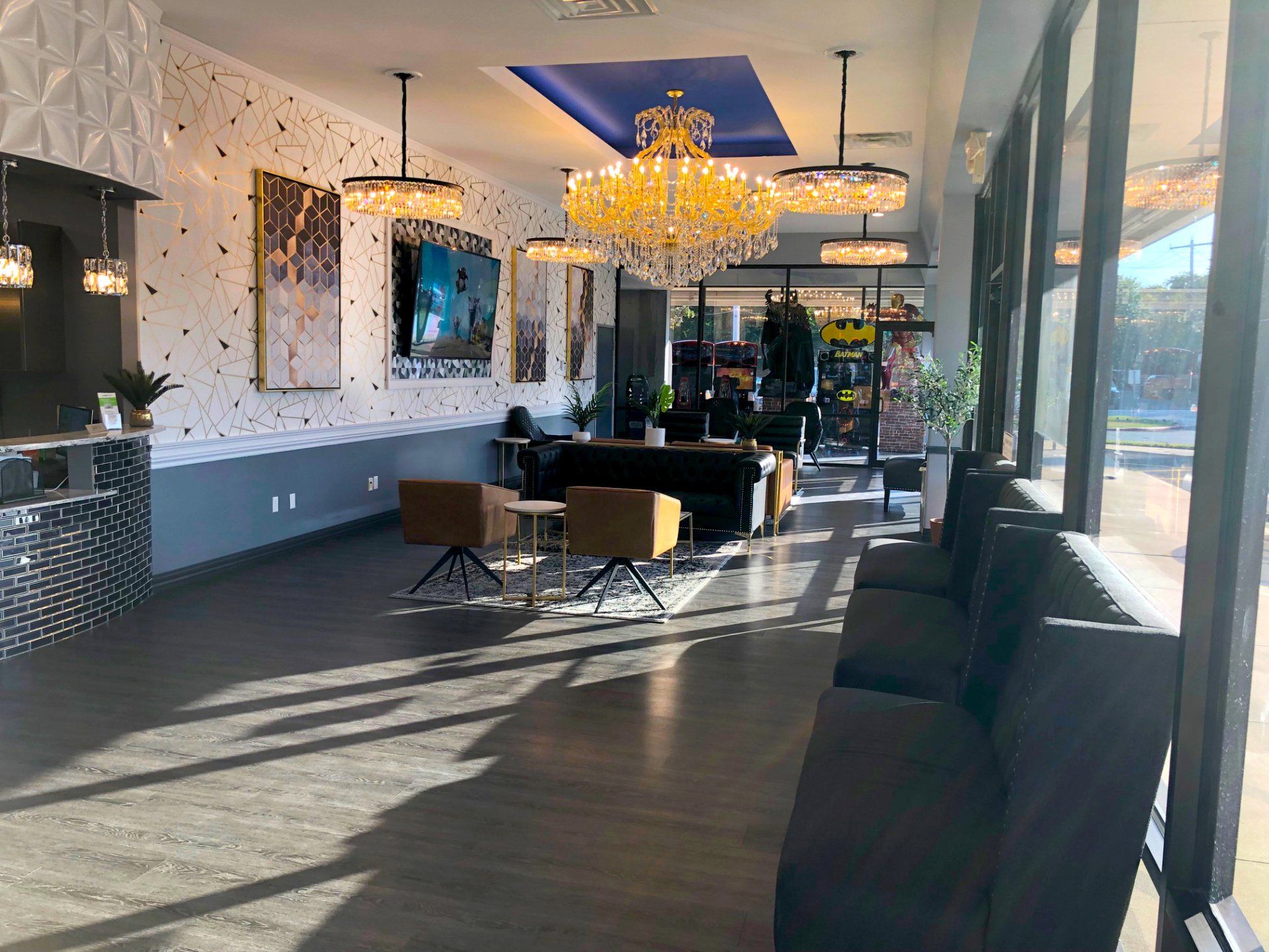 Lucent Dentistry in Austin Tx. A large room with a lot of windows and a chandelier hanging from the ceiling.