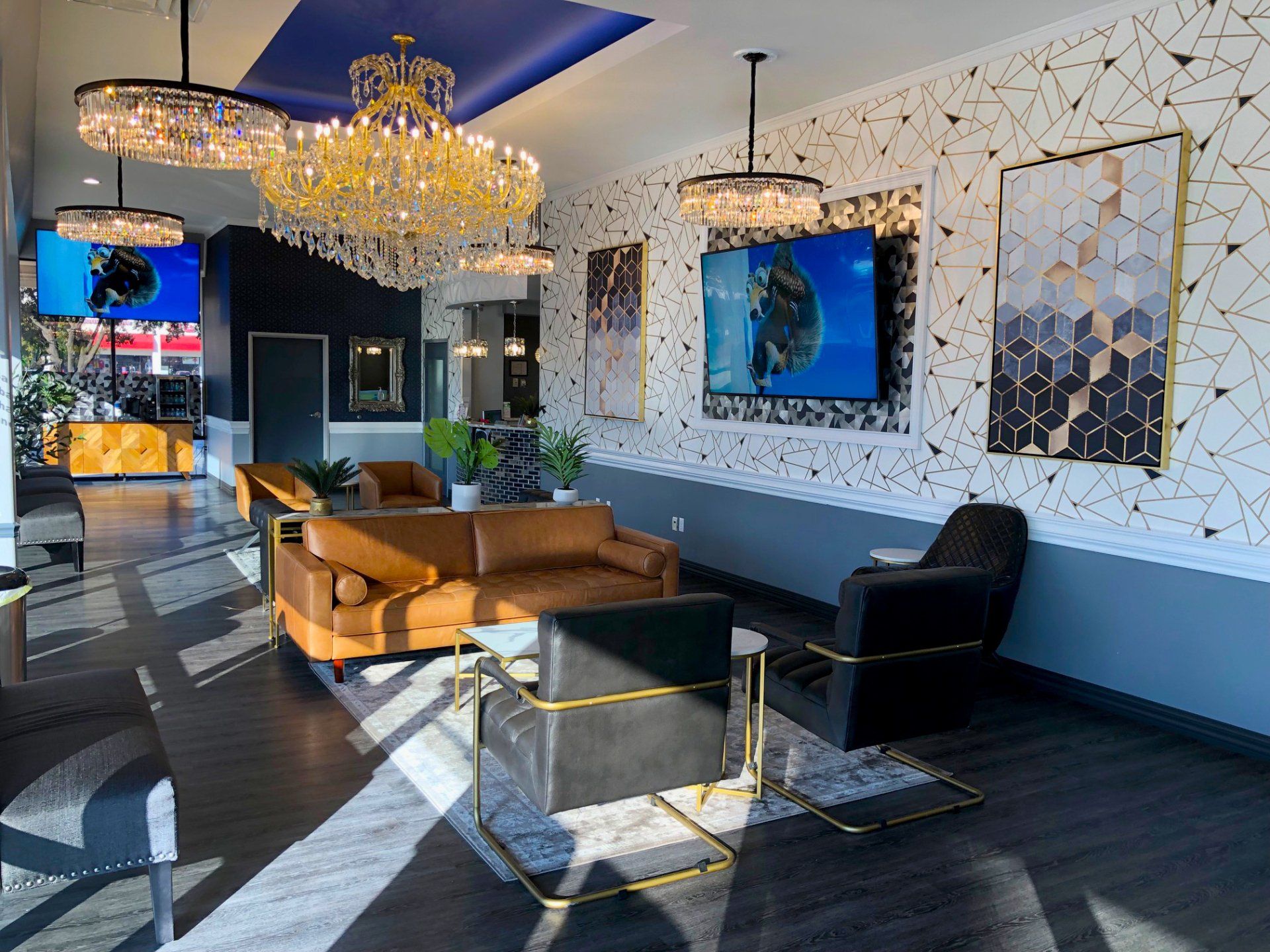 Lucent Dentistry in Austin Tx. A living room with a couch , chairs , and chandeliers.