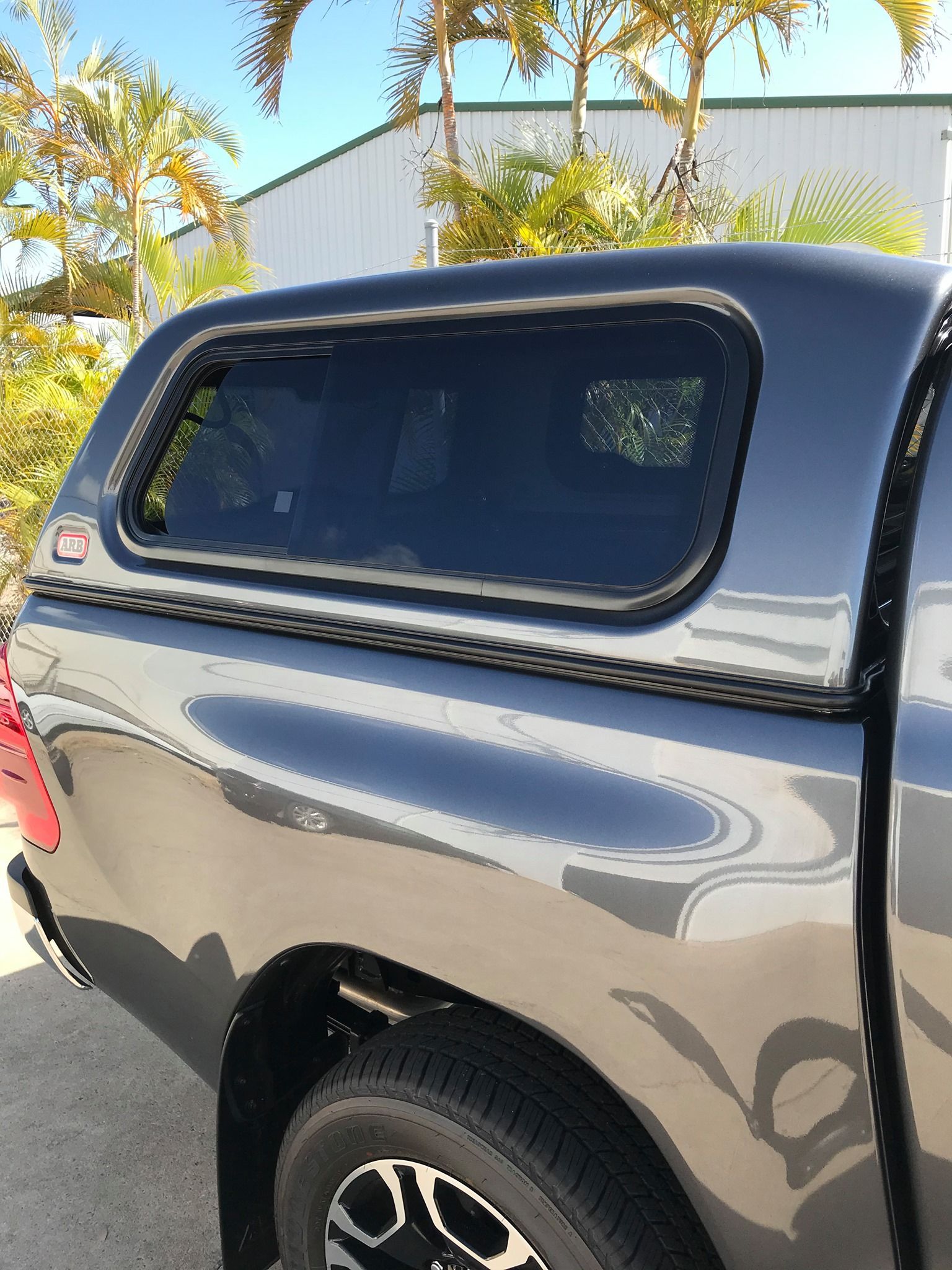 Silver car with black bumper, lights, and red tow hooks — Stay on Track 4X4 Accessories in Gladstone Central, QLD
