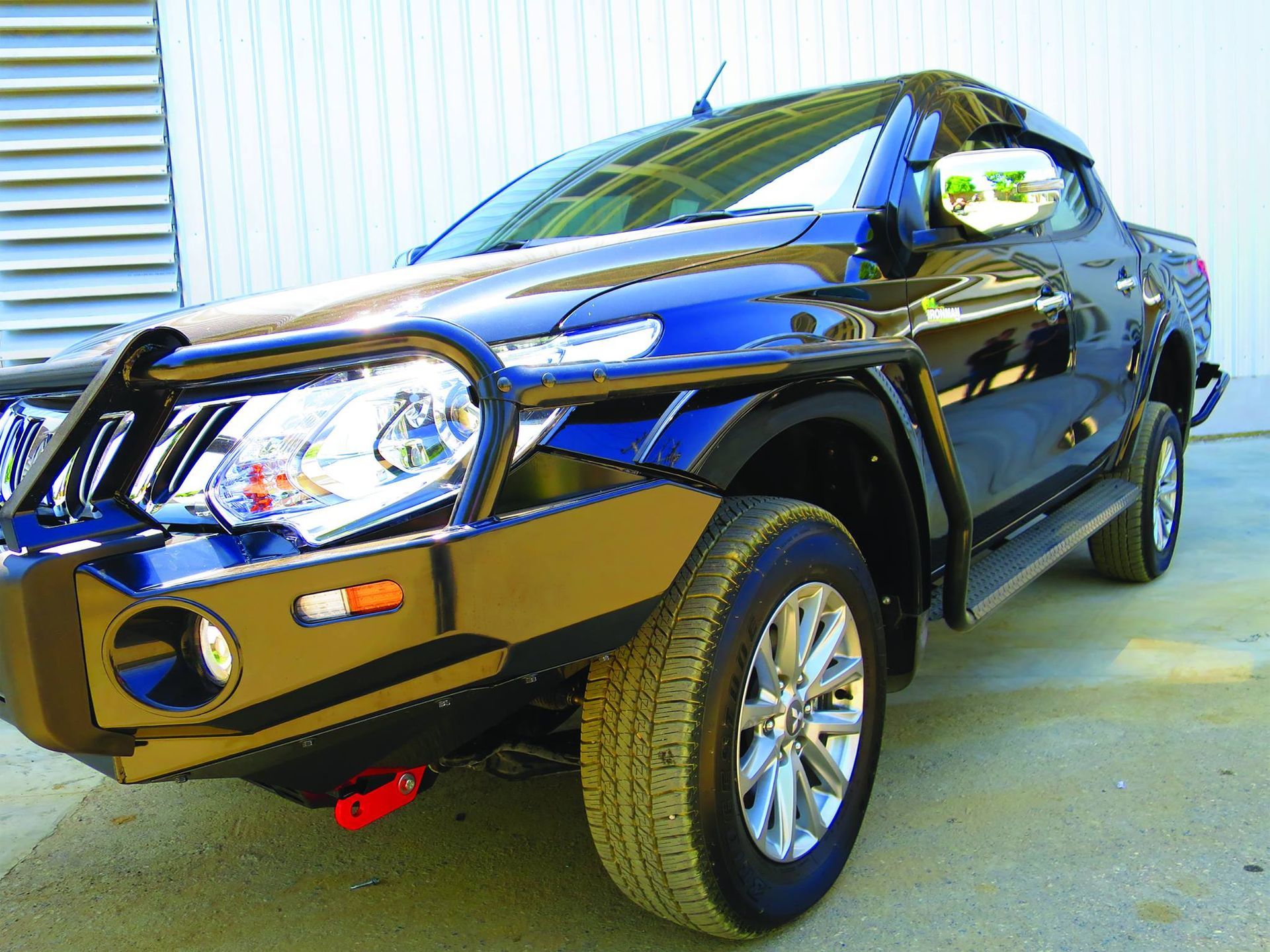 Black Jeep Wrangler tire on rocky terrain — Stay on Track 4X4 Accessories in Gladstone Central, QLD