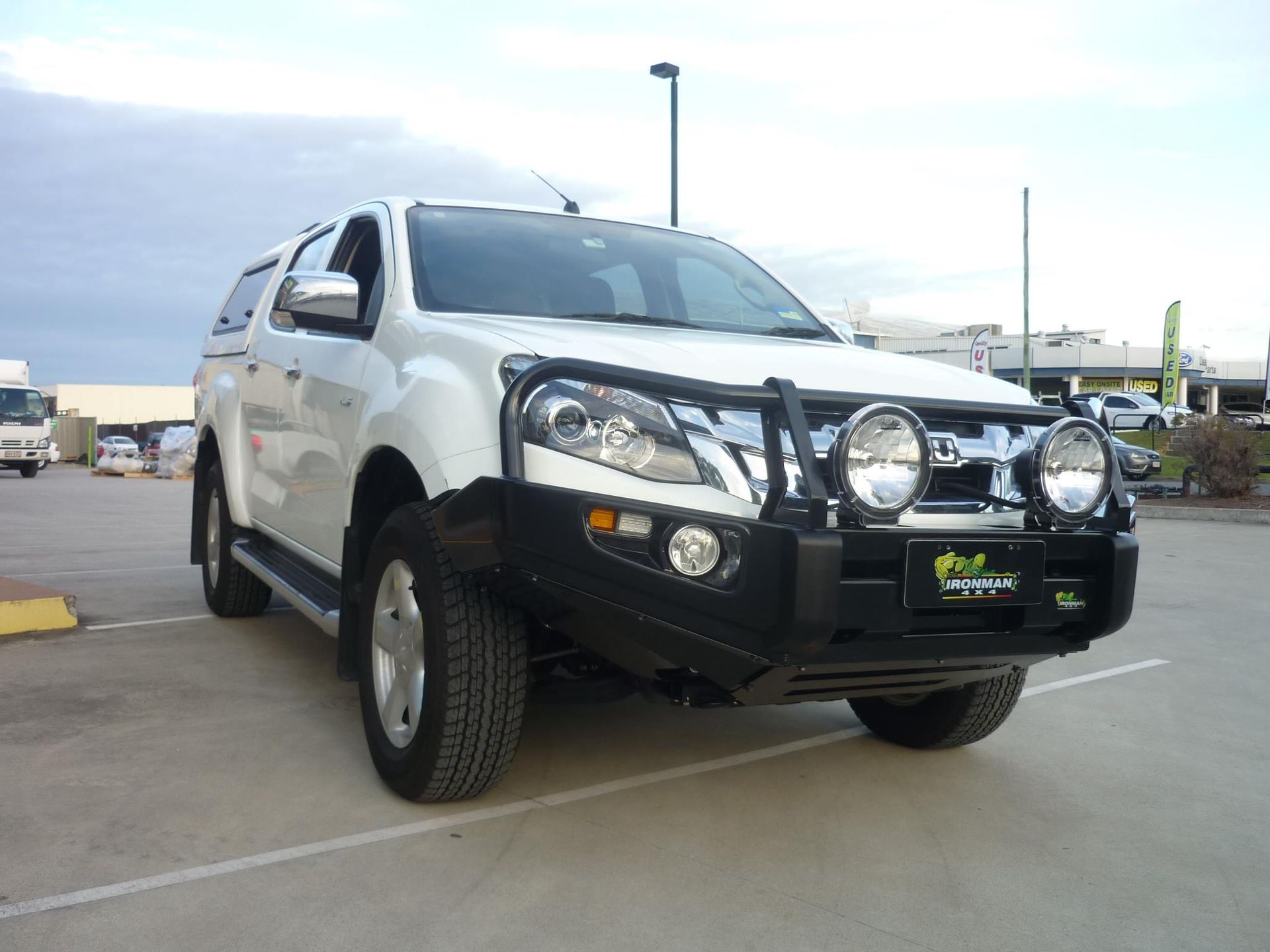 White Isuzu Truck With a Black Bull Bar and Spotlights — Stay on Track 4X4 Accessories in Gladstone Central, QLD