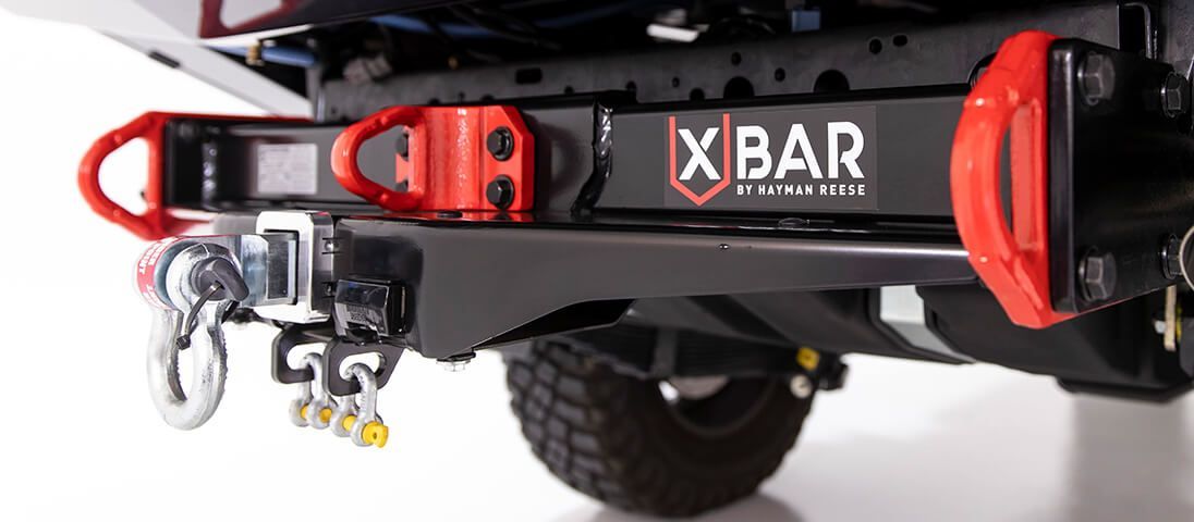Silver Car With Roof Rack Parked on a Beach, Waves Lapping the Side — Stay on Track 4X4 Accessories in Gladstone Central, QLD