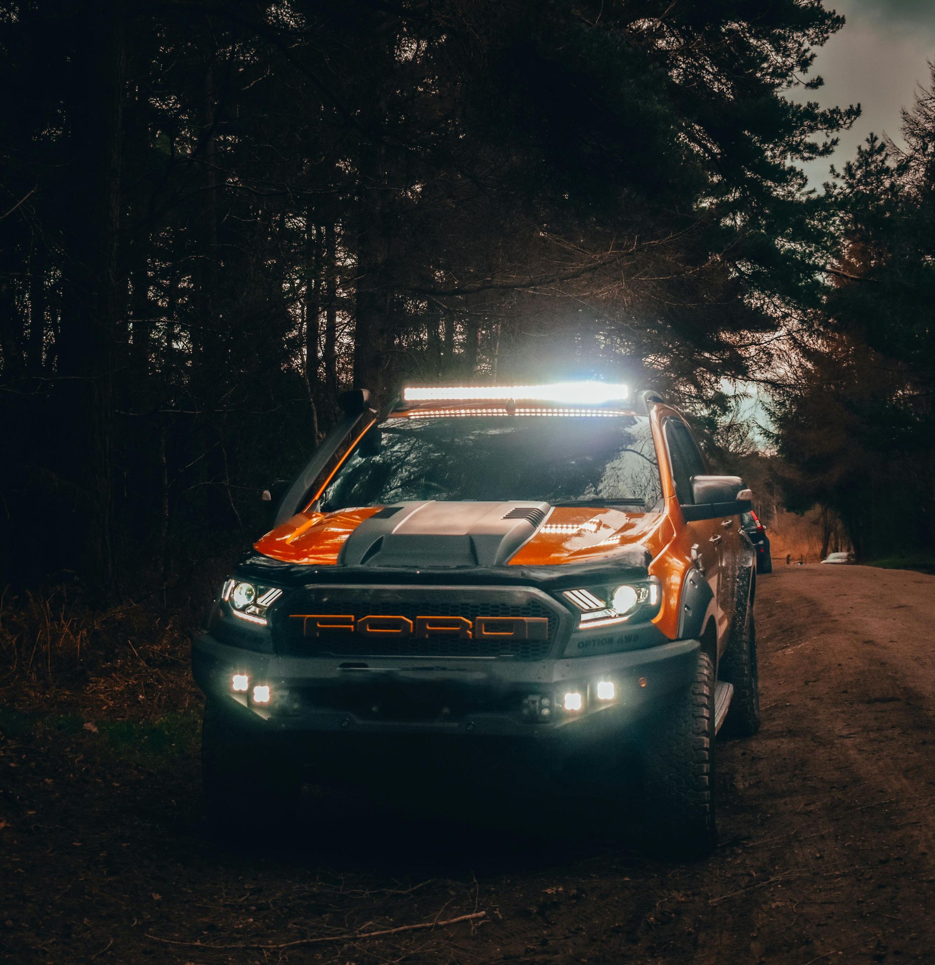 Close-up of Orange Truck Front With Black Bumper — Stay on Track 4X4 Accessories in Gladstone Central, QLD