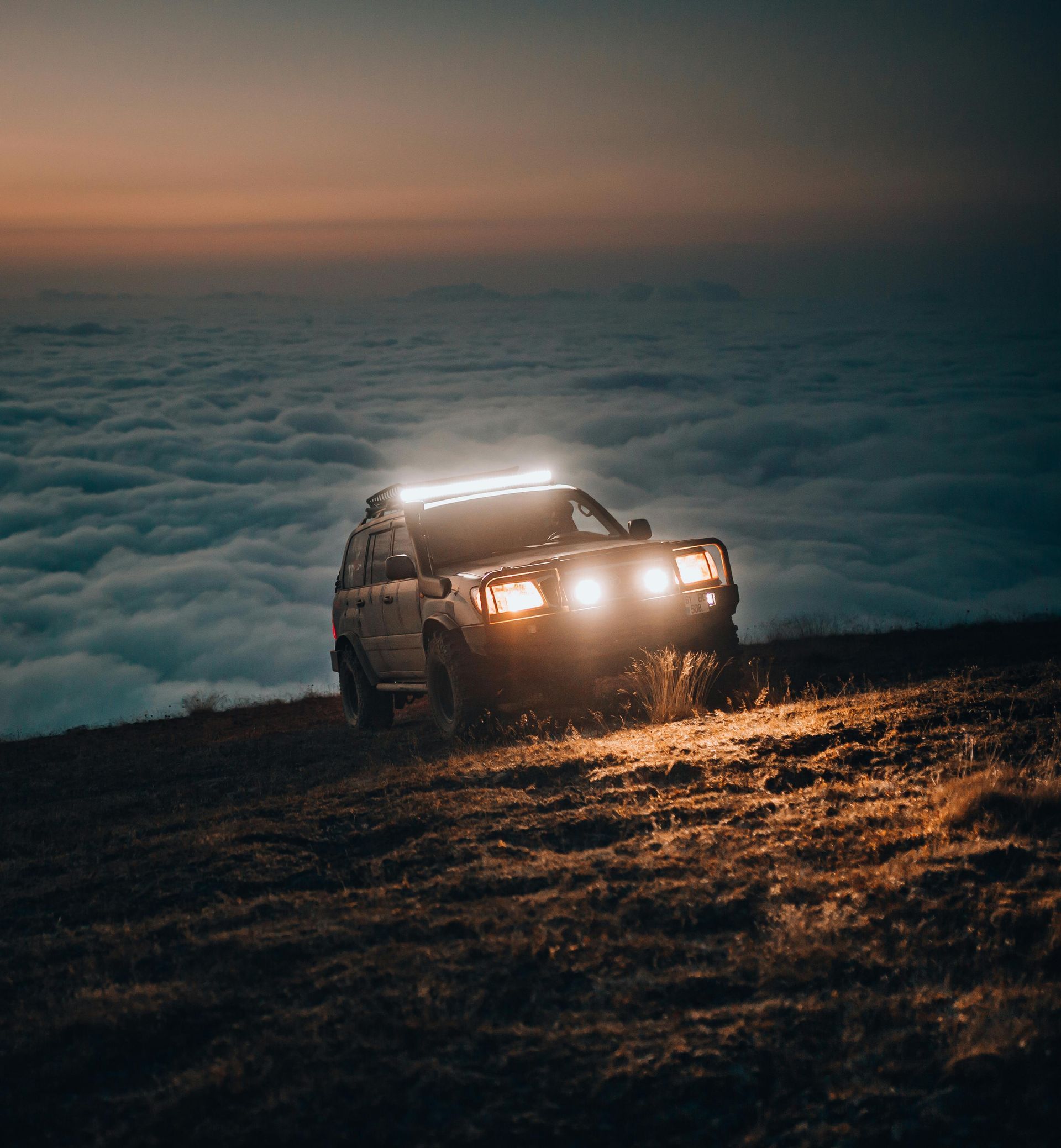 Mechanic Works on the Underside of a Vehicle, in a Shop — Stay on Track 4X4 Accessories in Gladstone Central, QLD
