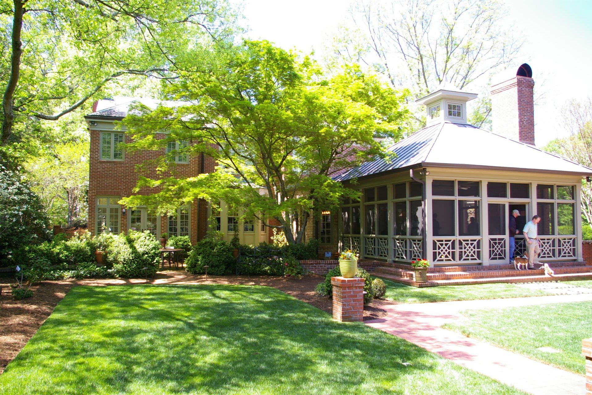 A house with a screened in porch in front of it