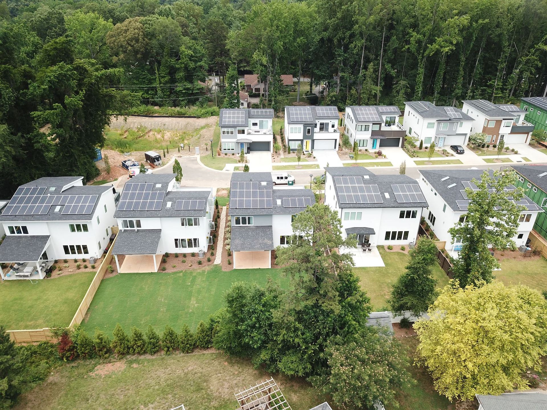 An aerial view of a residential area with lots of houses and trees