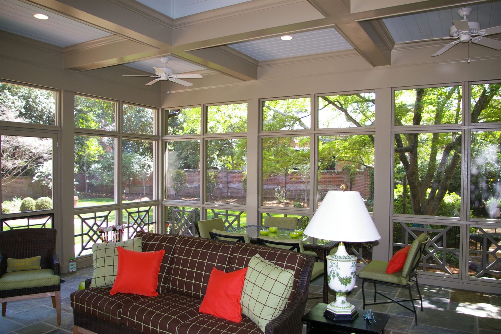 A living room with a couch and a lamp