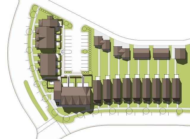 an aerial view of a row of houses and a parking lot