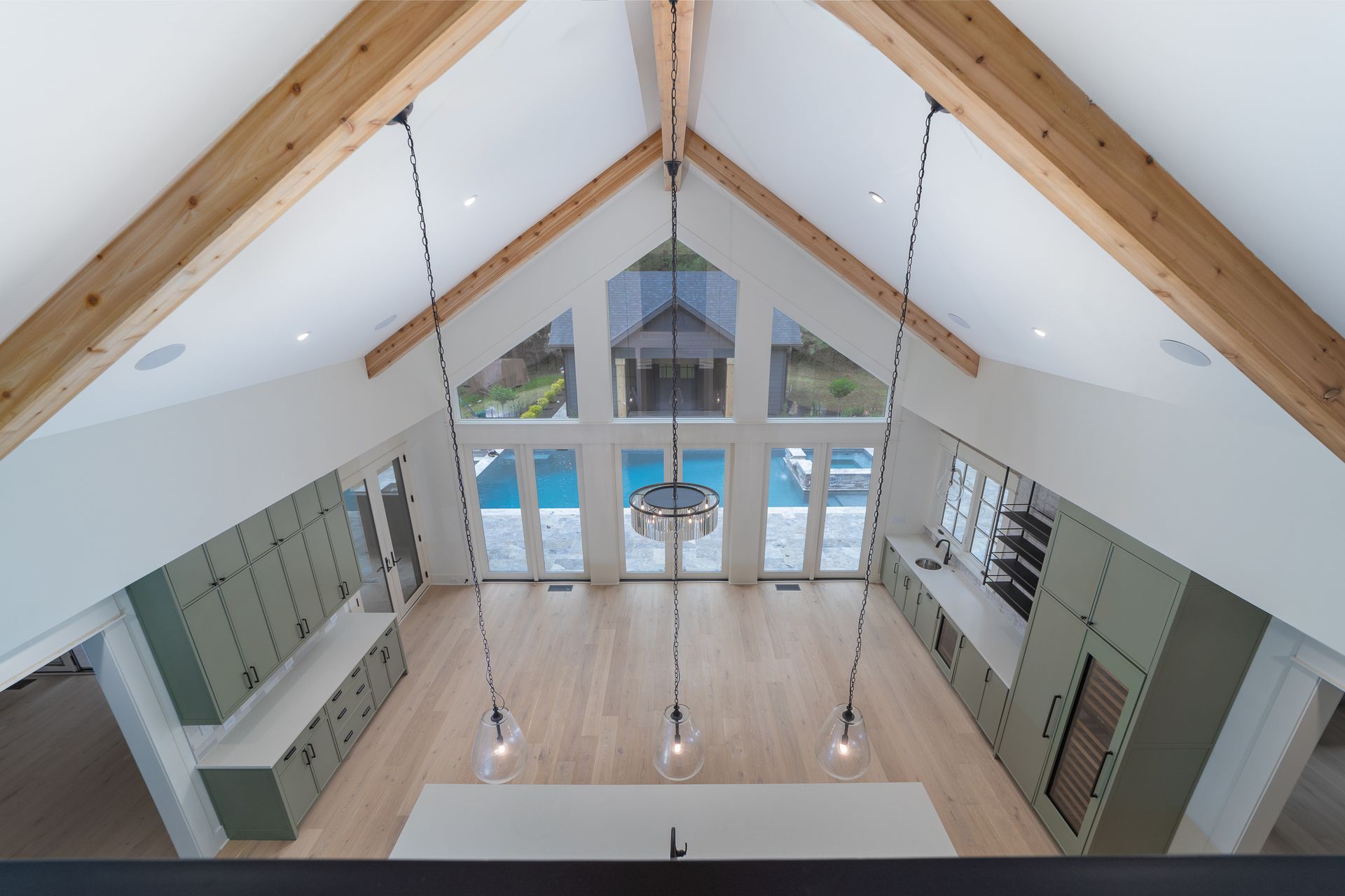 An aerial view of a kitchen with a vaulted ceiling