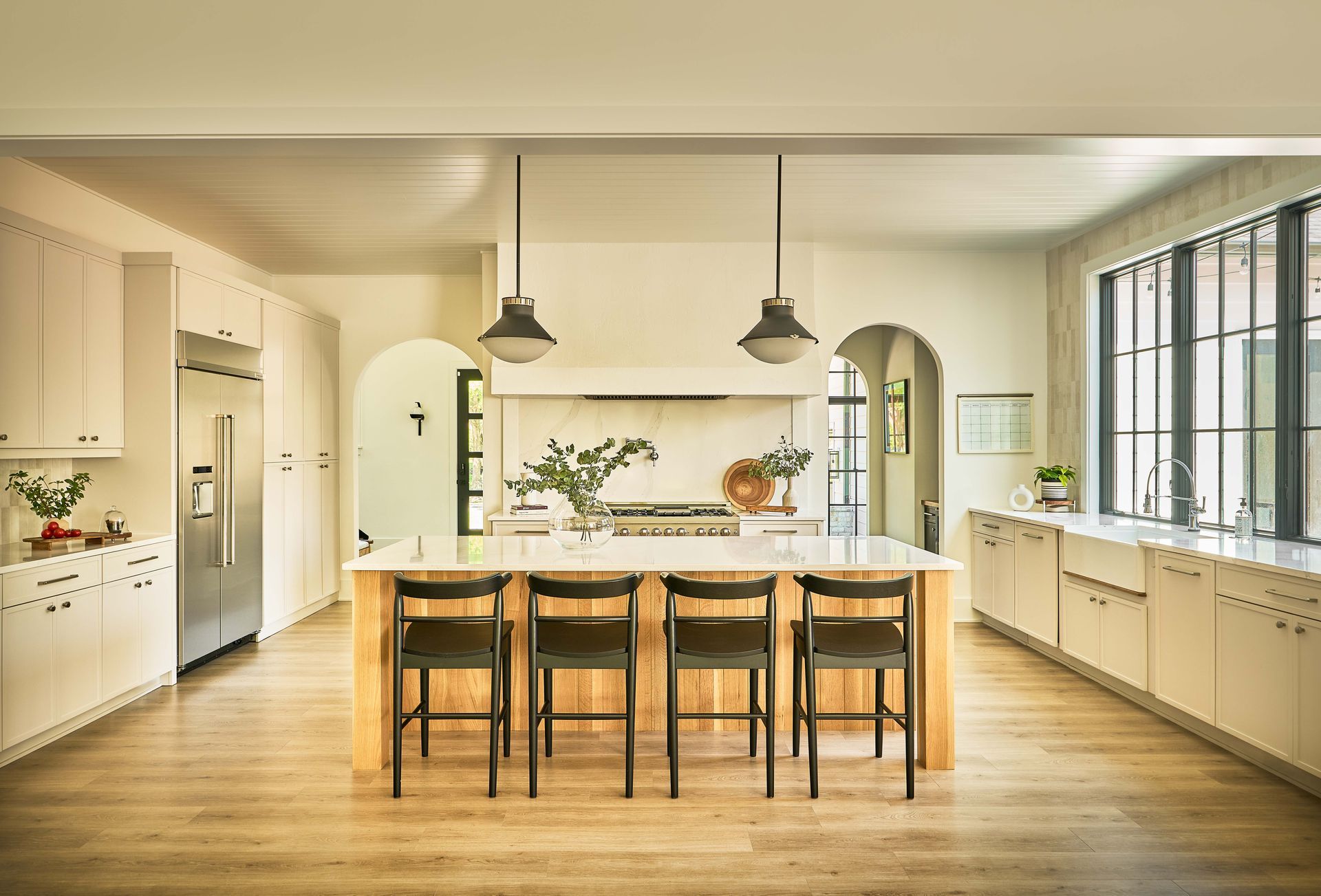 a living room with a ceiling fan and a flat screen tv