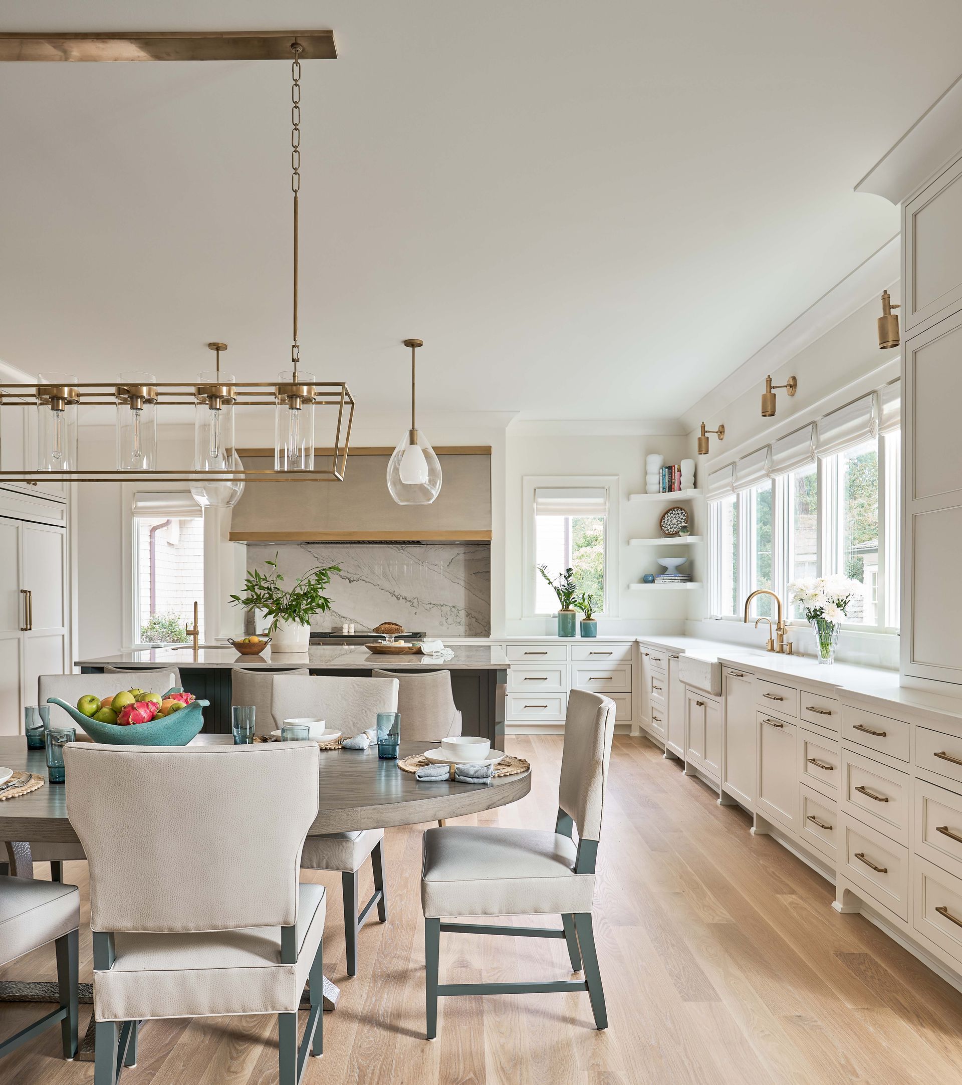A kitchen with a table and chairs in it