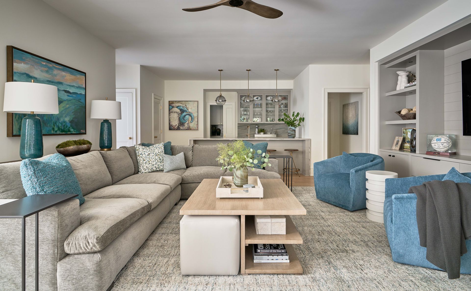 A living room filled with furniture and a ceiling fan.