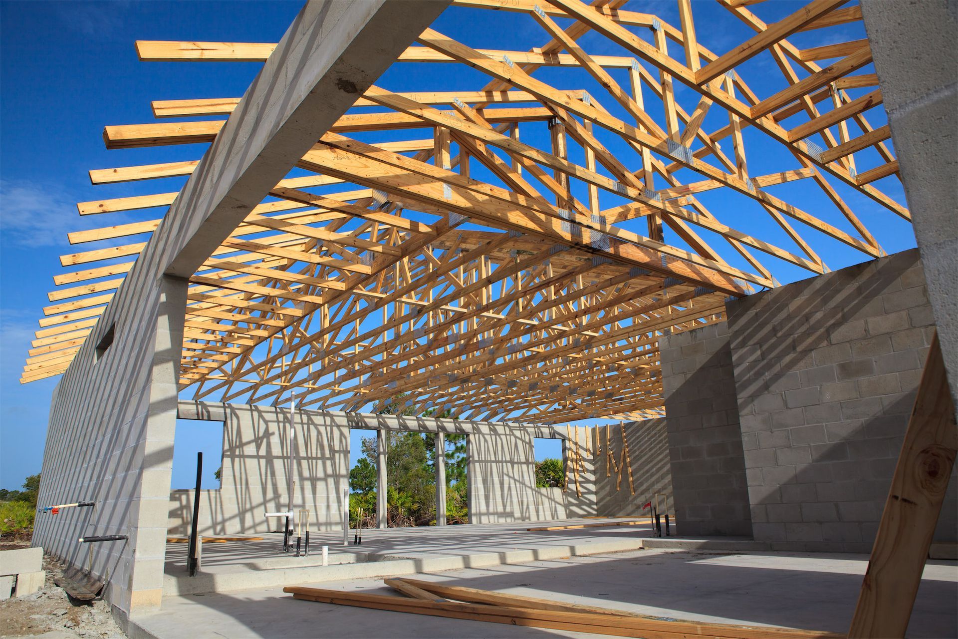 a building under construction with a lot of wooden beams