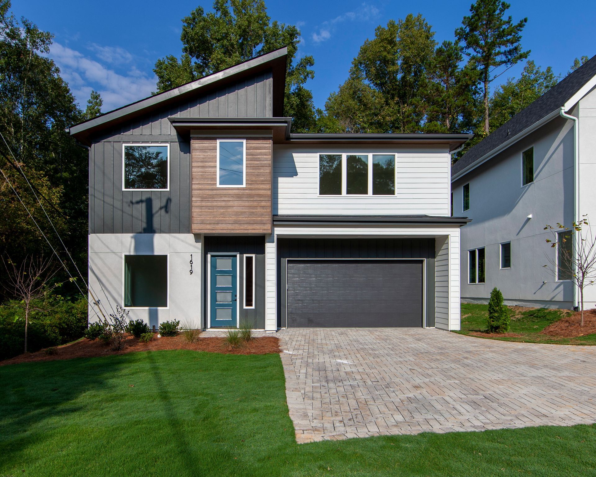 A modern house with a garage and a driveway