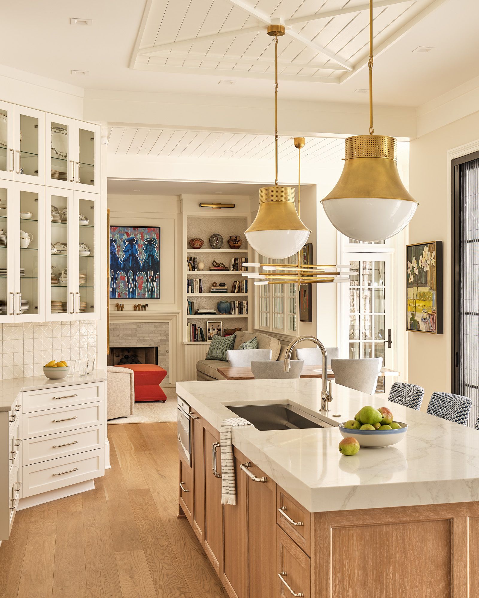 A kitchen with a large island and a sink