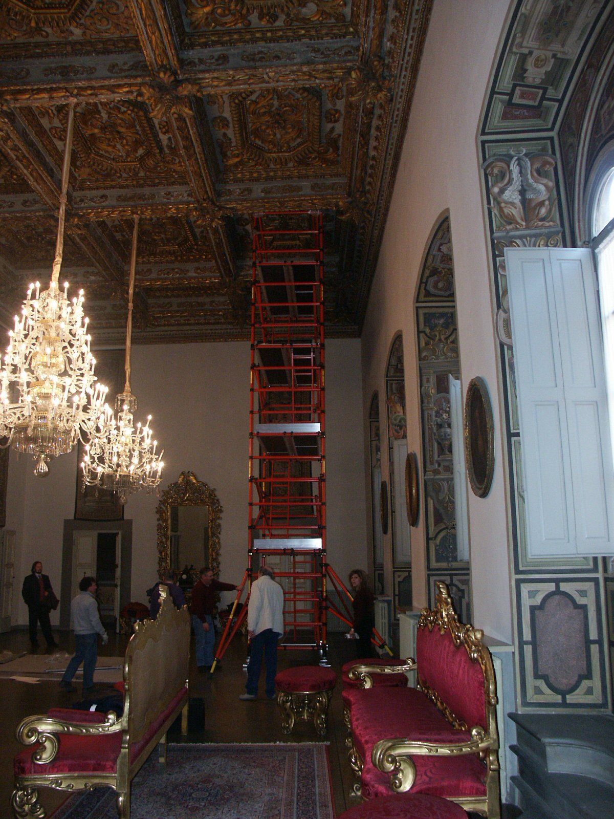A large room with a red ladder in the middle of it