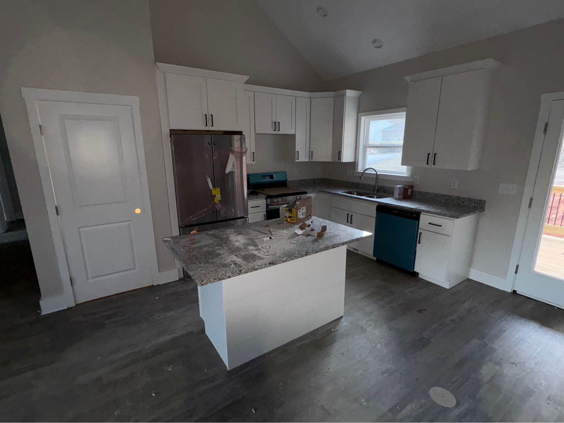 A kitchen with a large island in the middle of the room.