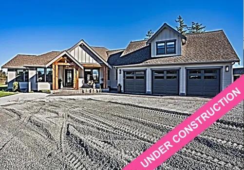 A large house with a sign that says under construction in front of it.
