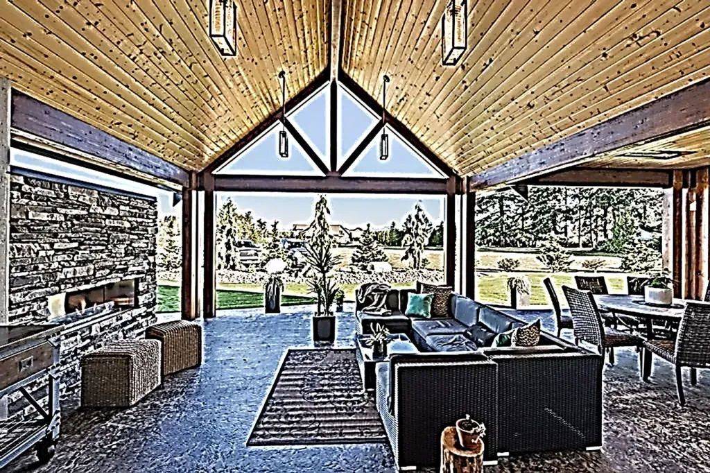 A living room with a lot of furniture and a large window.