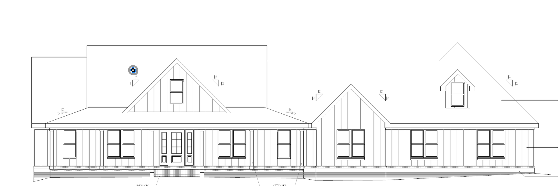 A house with a green roof and a garage is sitting on top of a hill surrounded by trees.