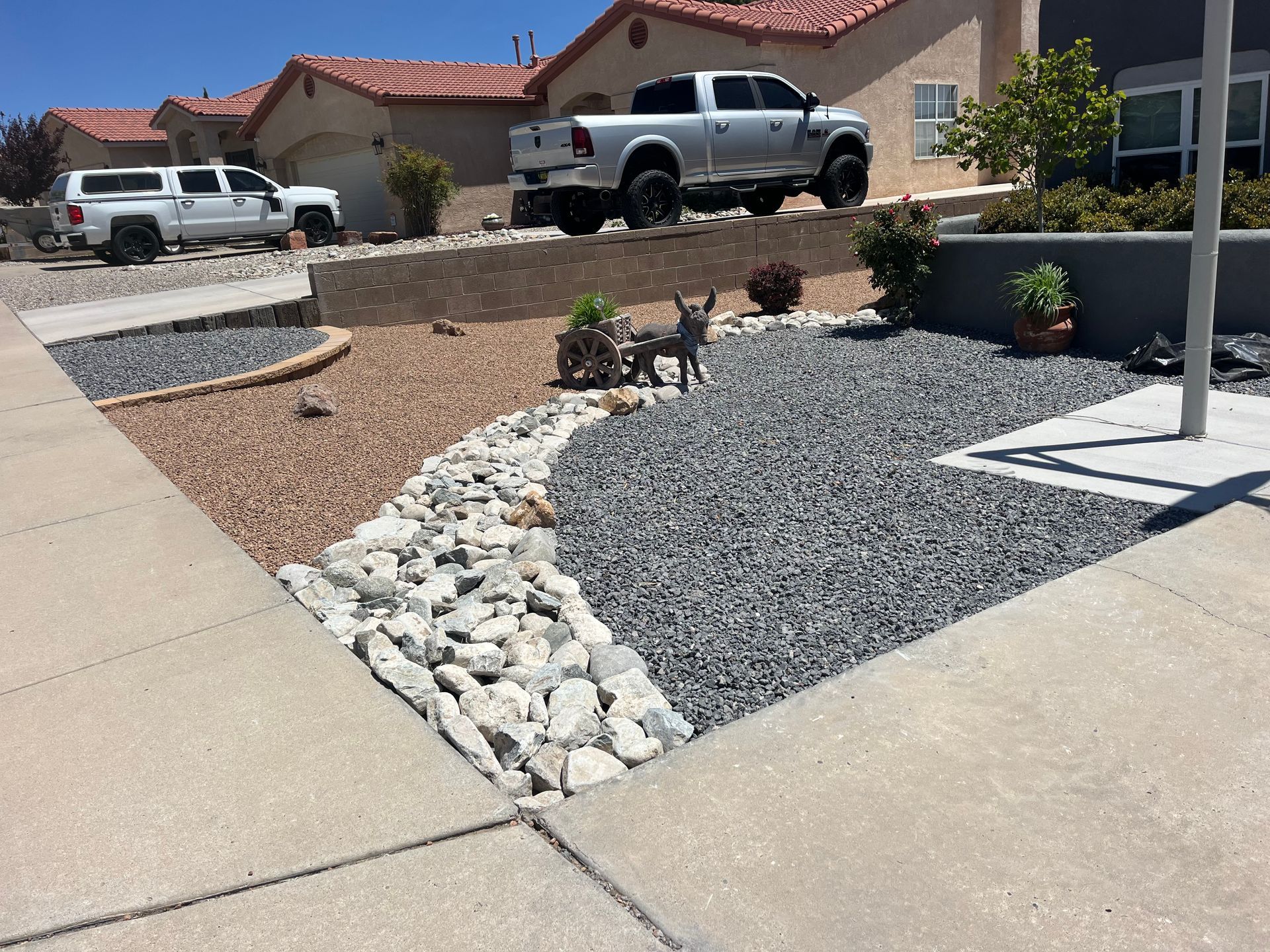 A white truck is parked in front of a house