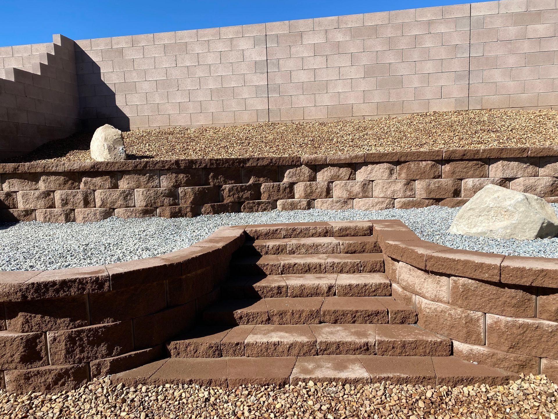 A stone wall with stairs leading up to it