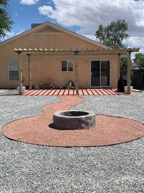 A house with a fire pit in front of it