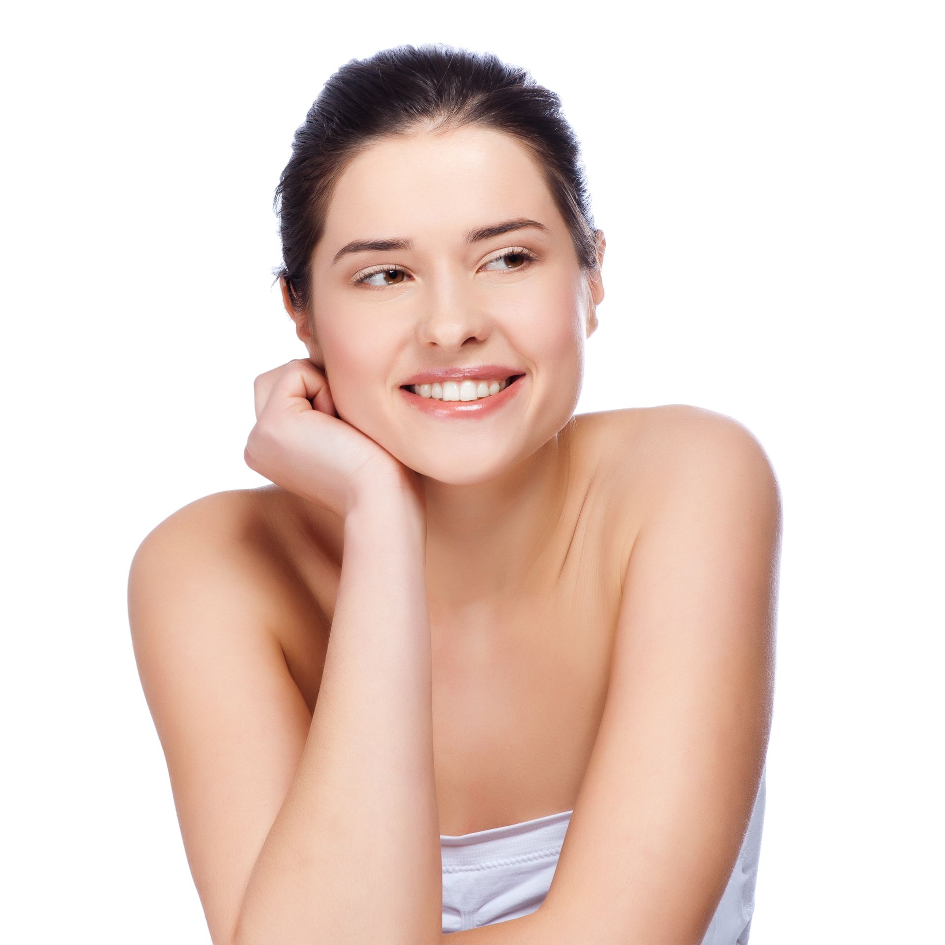 A woman is smiling with her hand on her chin.