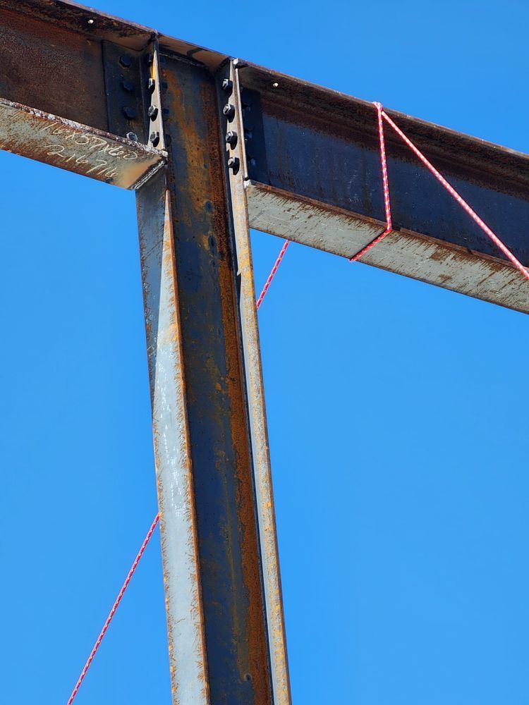 A metal structure with a blue sky in the background