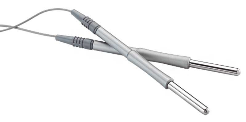 A pair of metal sticks with a cord attached to them on a white background.