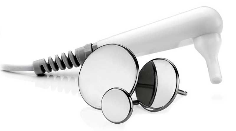 A stethoscope is sitting next to a pair of mirrors on a white surface.