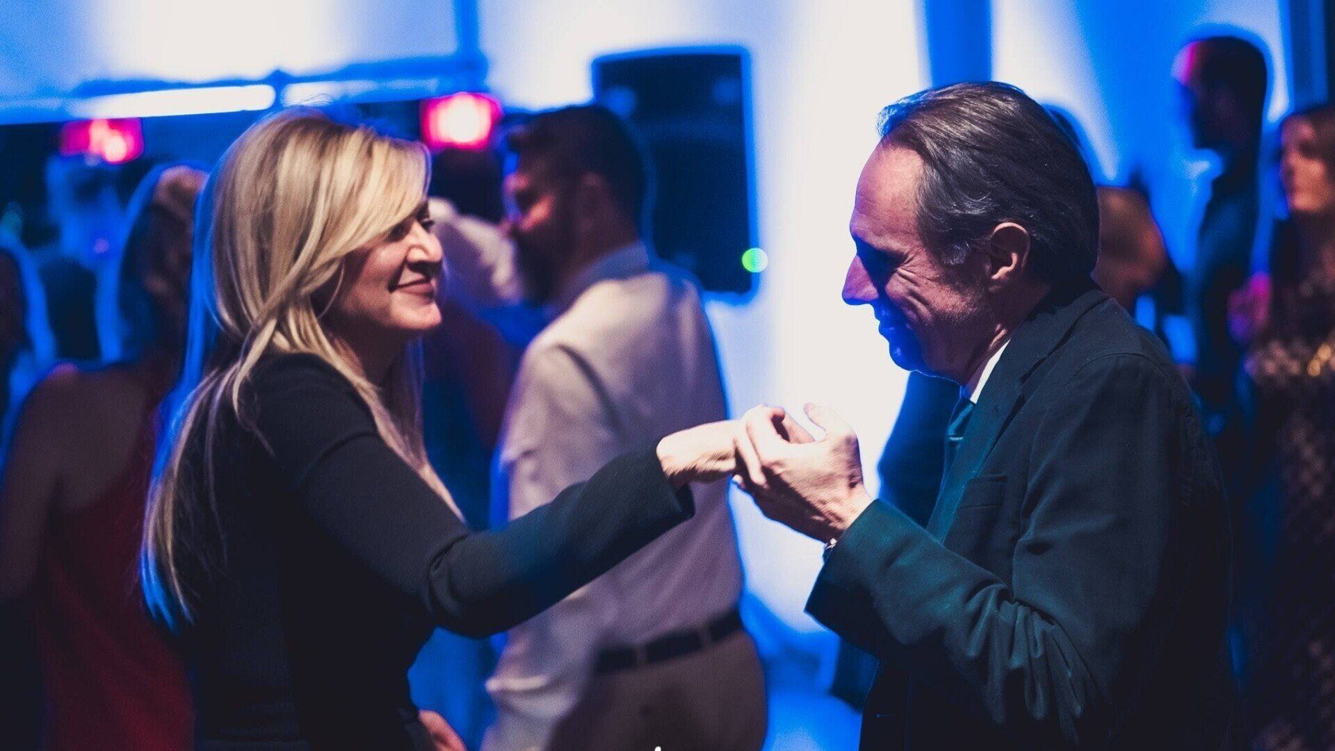 Lighting setup and clients dancing at birthday party